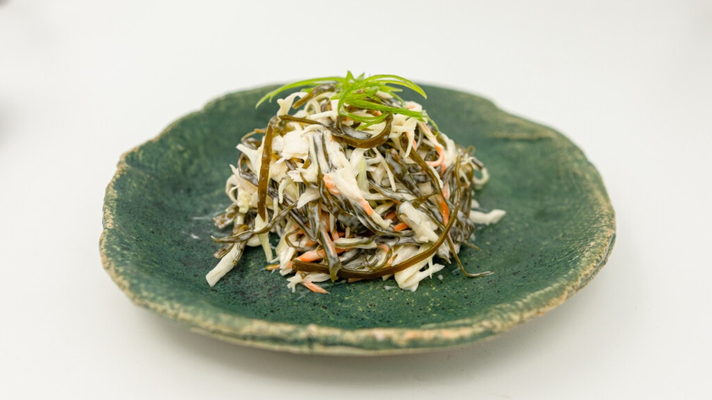coleslaw with sugar kelp on a plate