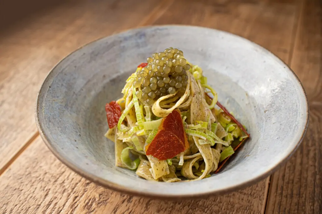pasta in bowl with seaweed caviar
