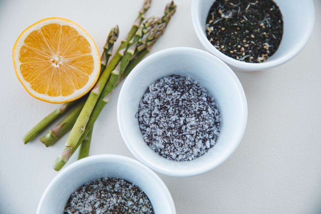 Seaweed salt in a bowl by lofoten seaweed with lemon and asparagus